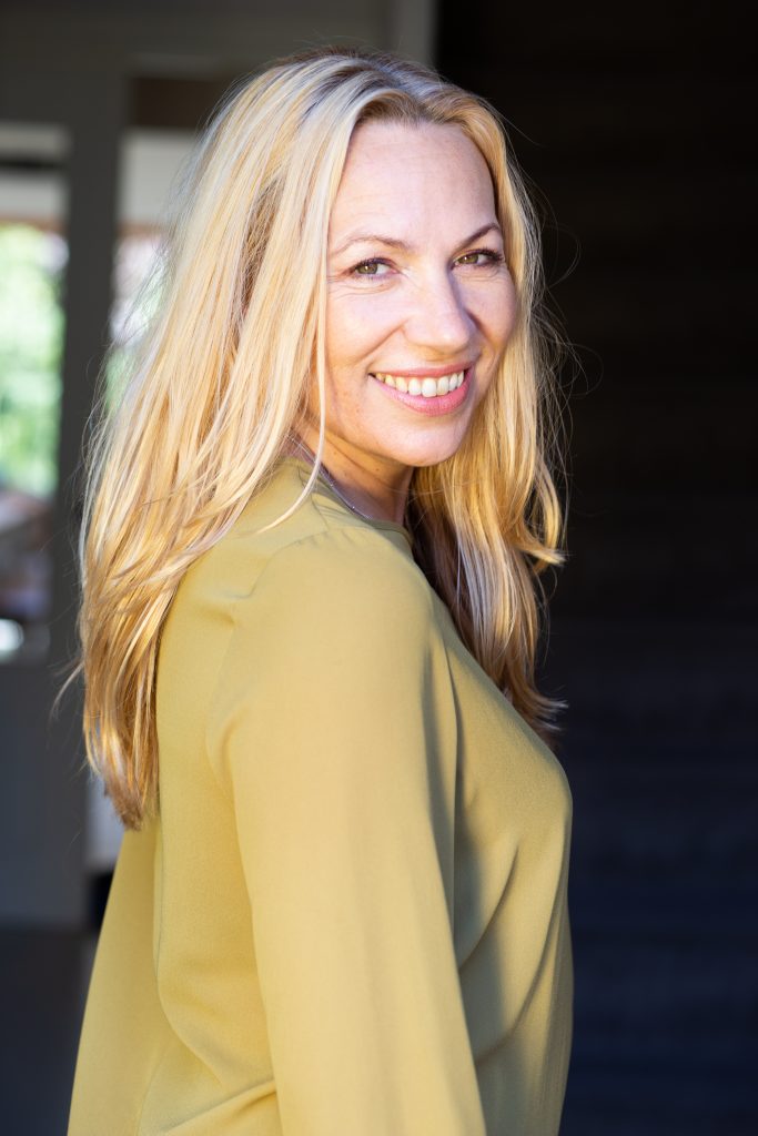 Pretty blonde woman turning to the camera